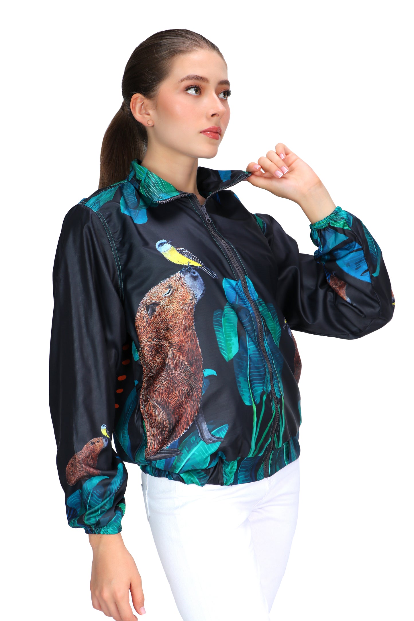 Graphite gray eco-conscious jacket featuring our Capybara friend with a yellow bird on the tip of its nose. Jacket has seven images of the Capybara surrounded by green leaves. The largest Capybara is on the back of the jacket.  Edit alt text