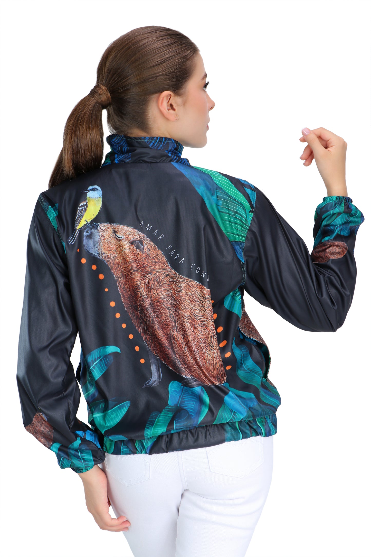 Graphite gray eco-conscious jacket featuring our Capybara friend with a yellow bird on the tip of its nose. Jacket has seven images of the Capybara surrounded by green leaves. The largest Capybara is on the back of the jacket.  Edit alt text